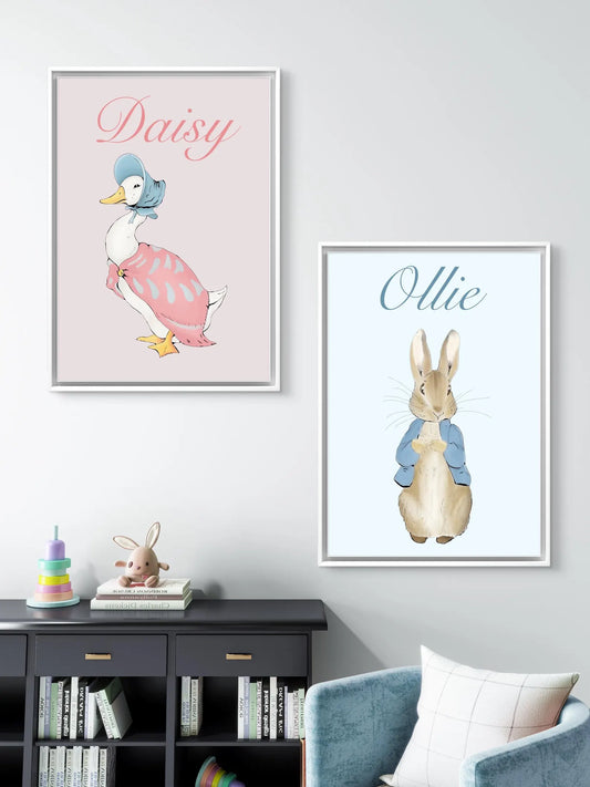 Two framed illustrations of a duck and a rabbit on a wall above a bookshelf.
